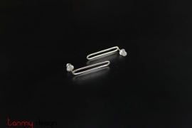 Silver earrings in the shape of paper pins